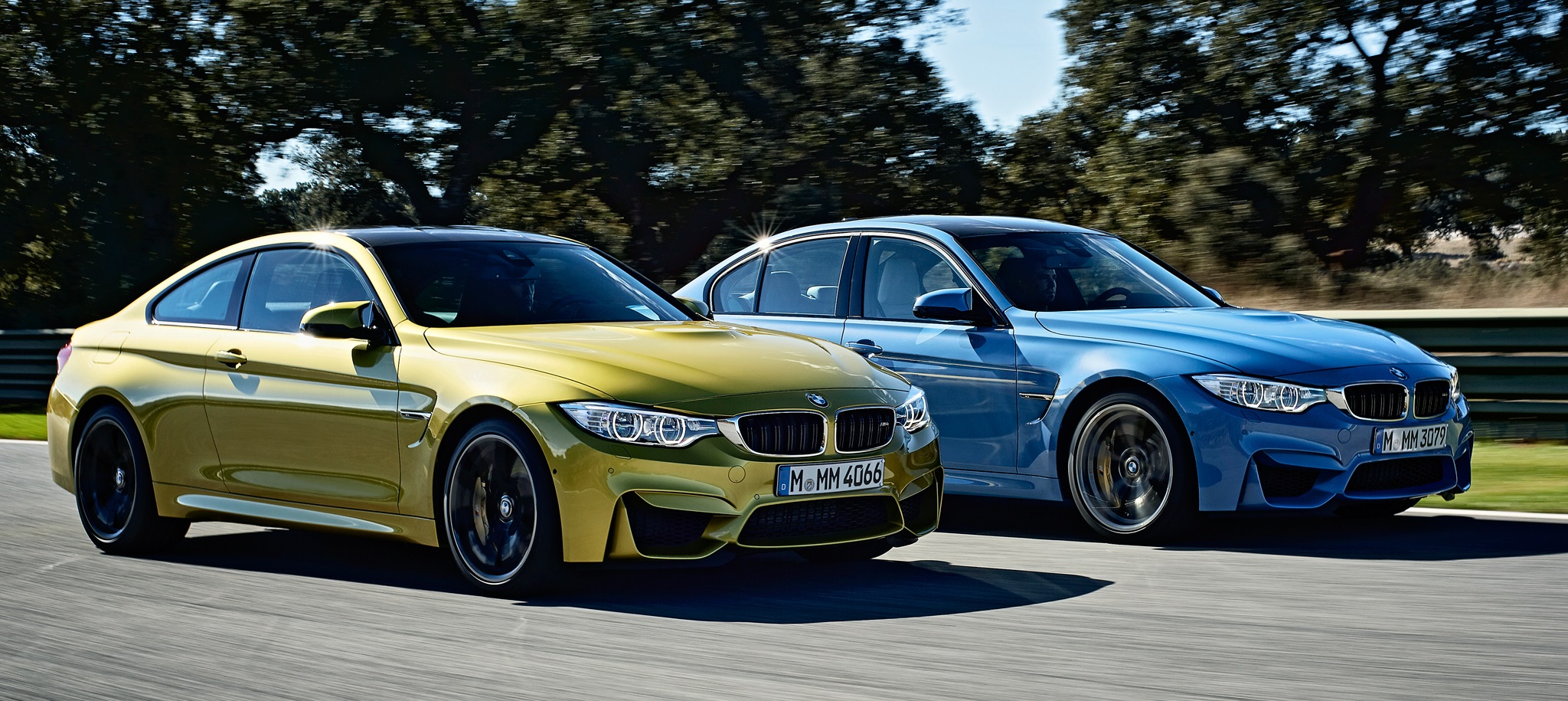 2015-bmw-m3-sedan-and-m4-coupe-front-view-in-motion